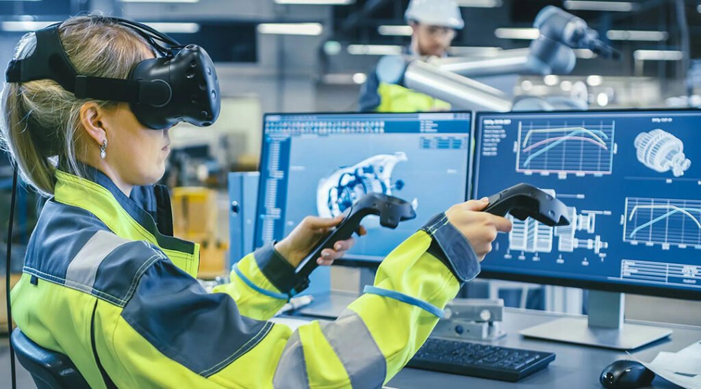 A woman wearing a high-visibility yellow uniform jacket and a virtual reality headset uses dual motion controllers to interact with complex 3D mechanical component schematics displayed on desktop monitors.